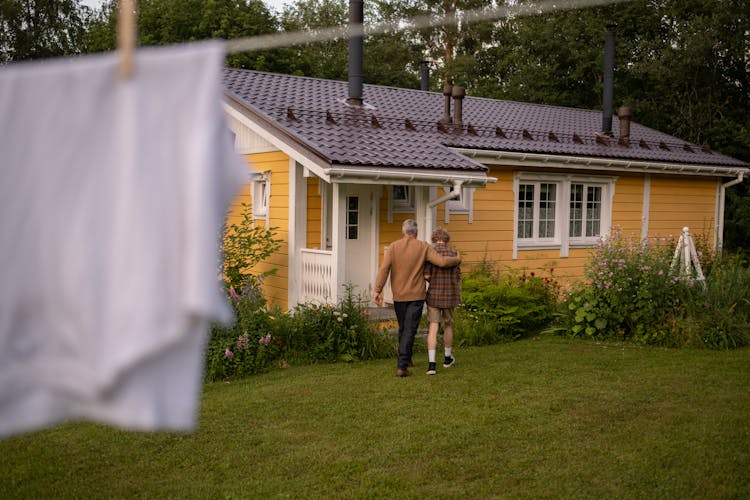 Grandfather And Grandson Walking Home