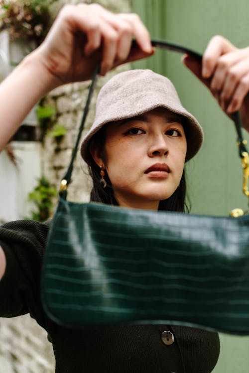 Free Close Up Photo of a Woman Holding a Bag Stock Photo