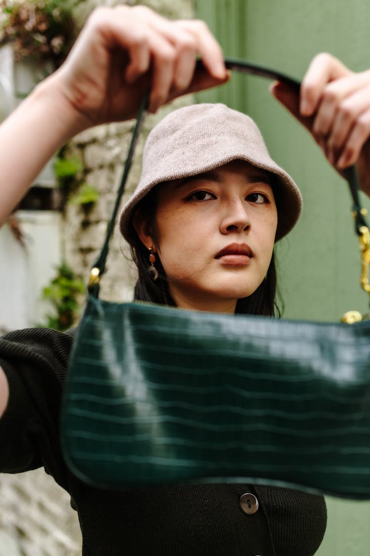 Close Up Photo Of A Woman Holding A Bag