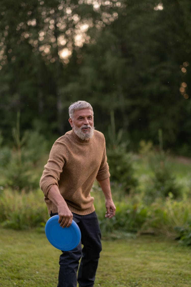 Elderly Man Playing Frisbee