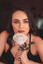 Portrait of Woman Holding White Rose