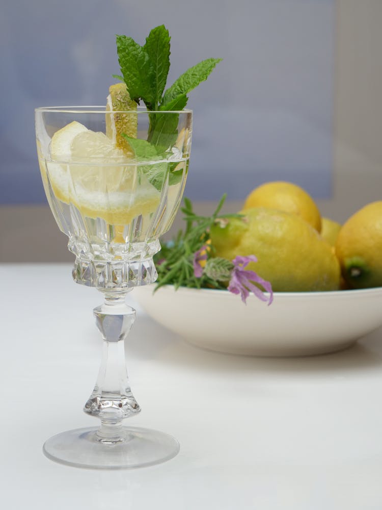 Glass With Water With Lemon On Table