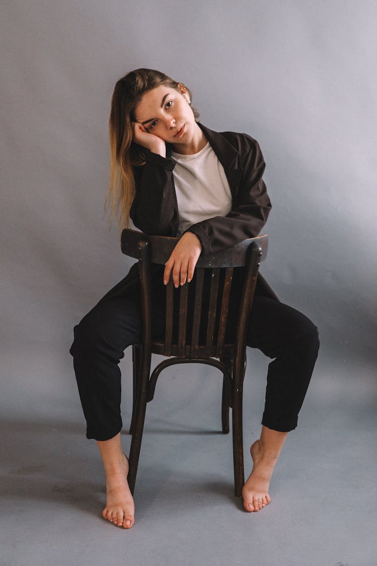 Young Woman On A Chair In Studio 