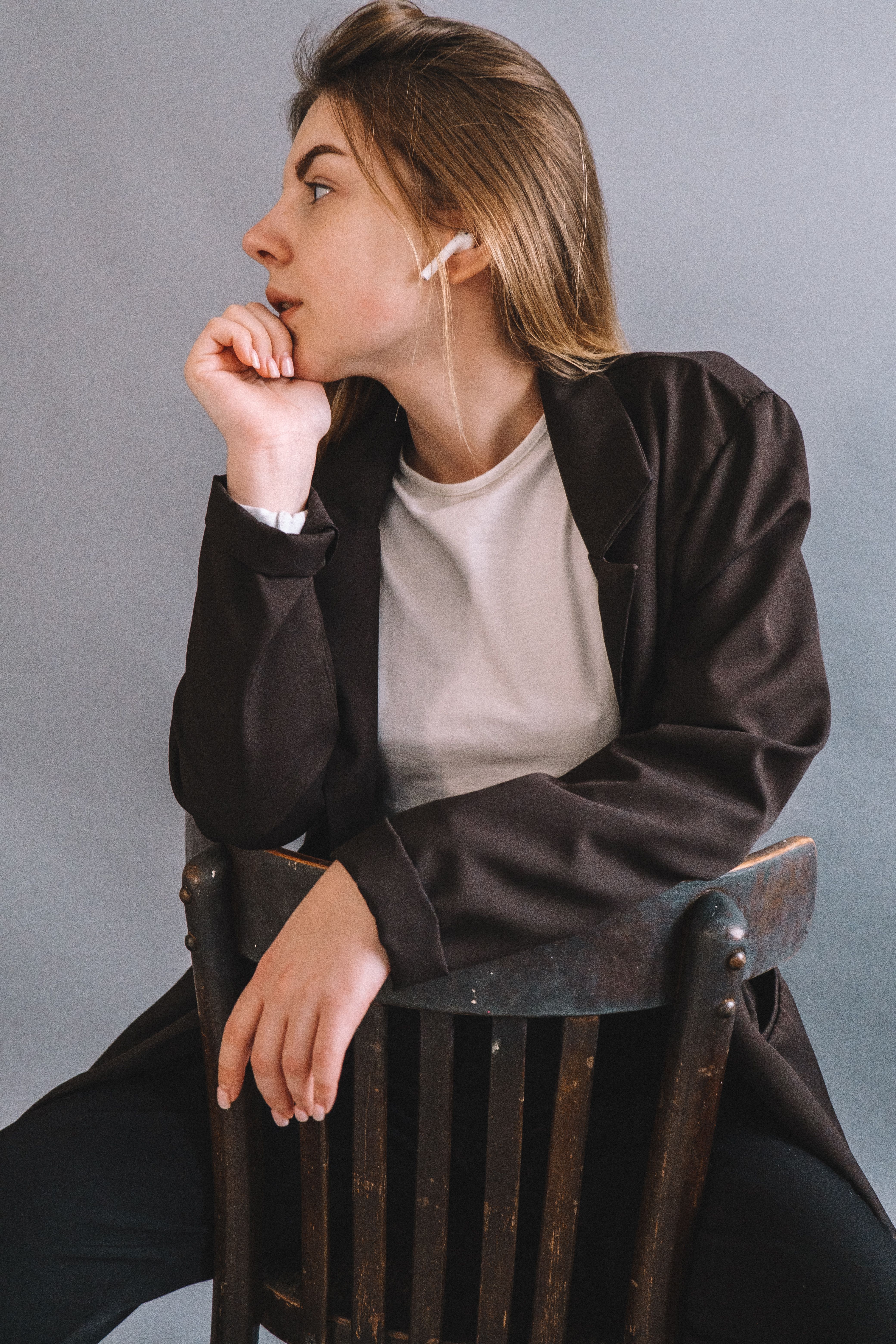 Woman in Black Blazer Sitting on a Chair · Free Stock Photo