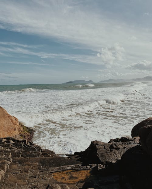 Waves Splashing Rocks on Beach