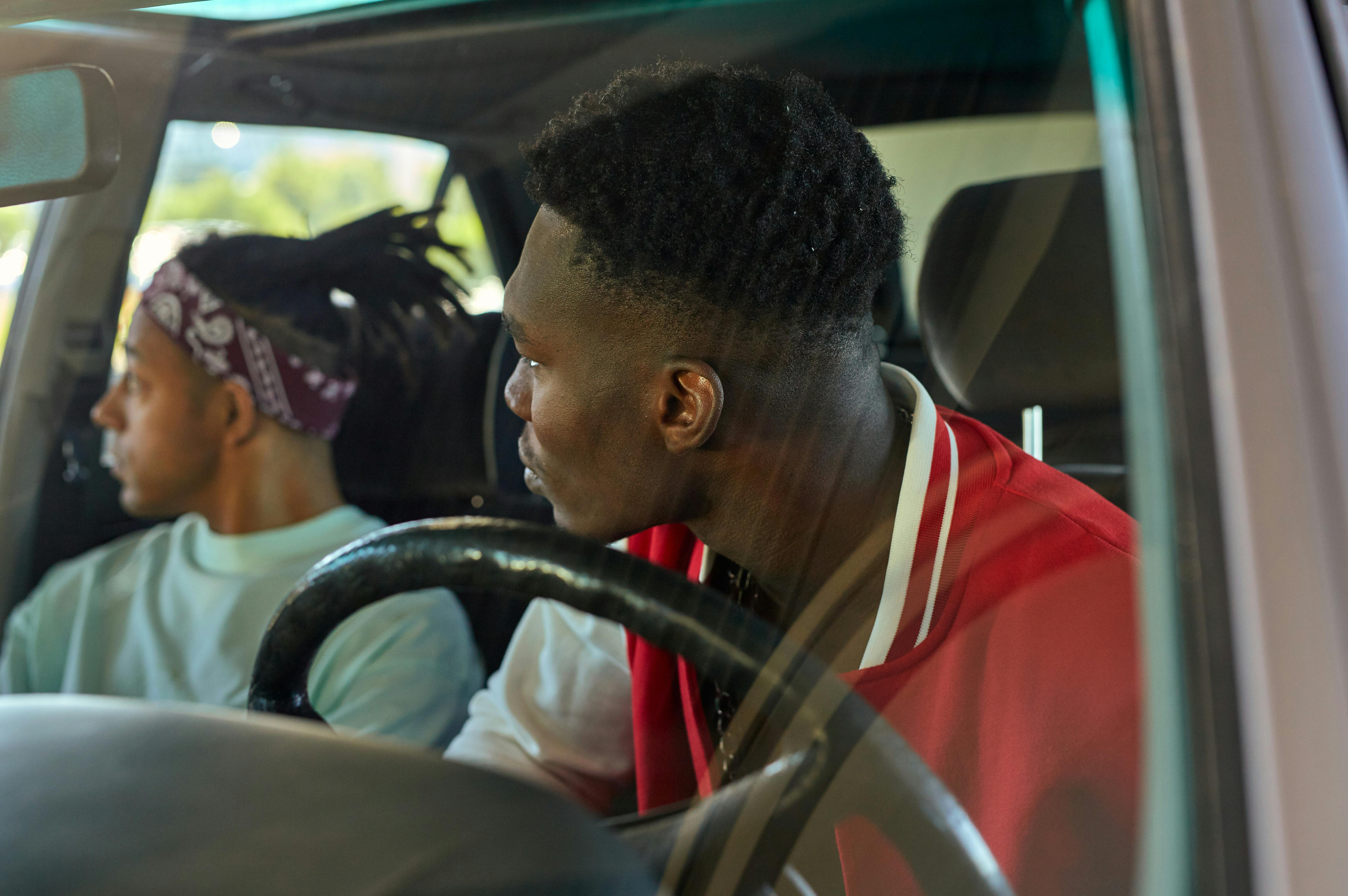 a man looking sideways while sitting in a car