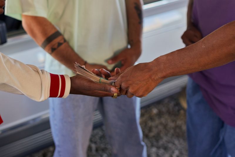 Hands exchanging cash