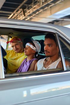 Young friends enjoying a car ride through the city streets. Captured in a candid moment.