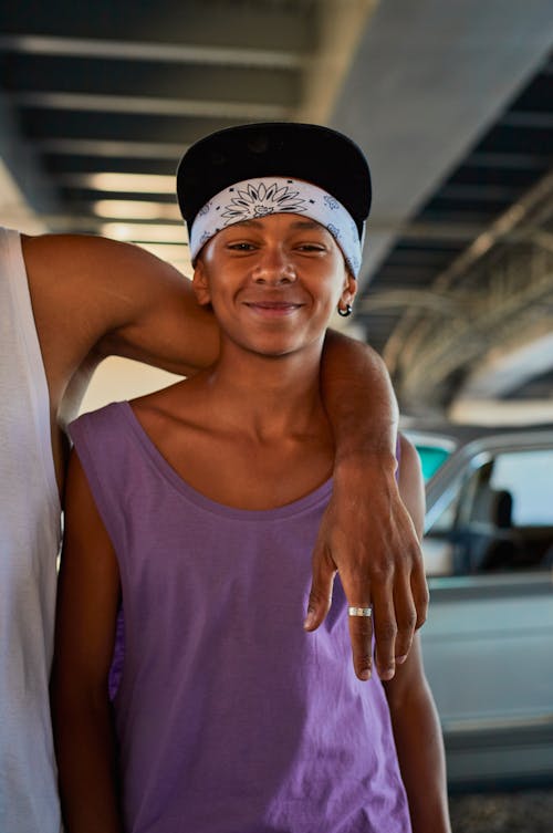 Smiling Boy in Tank Top