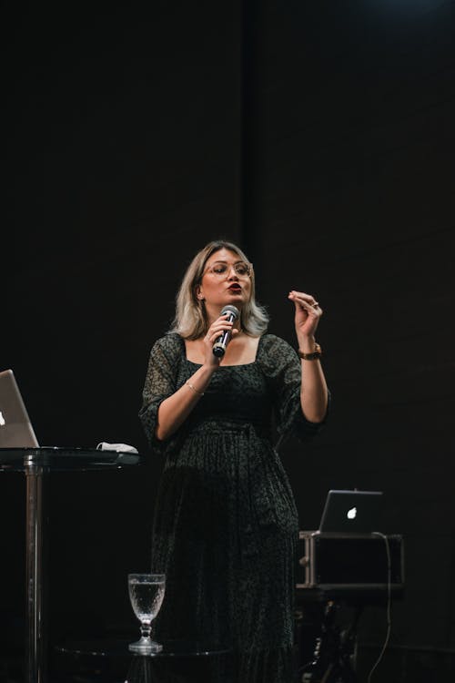 Woman Singing on Stage