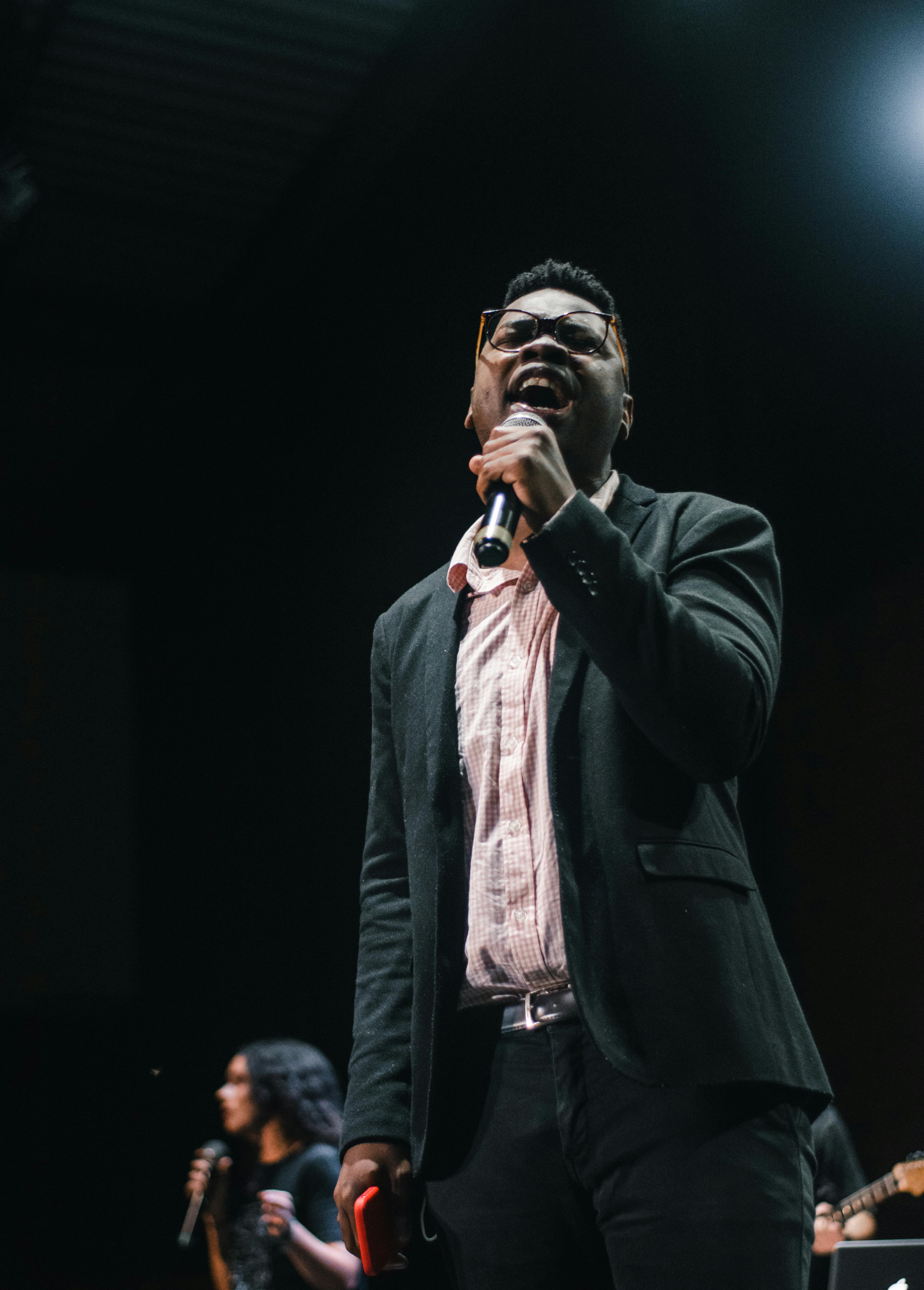 Couple embracing tenderly in soft morning light bedroom, post-intimacy glow after rainy night, peaceful surrender