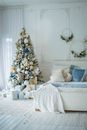 Christmas Tree and Wall Decorations in Bedroom Arranged in White and Blue 