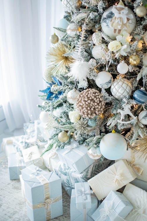 Decorated Christmas Tree and Gifts Arranged in Blue and White