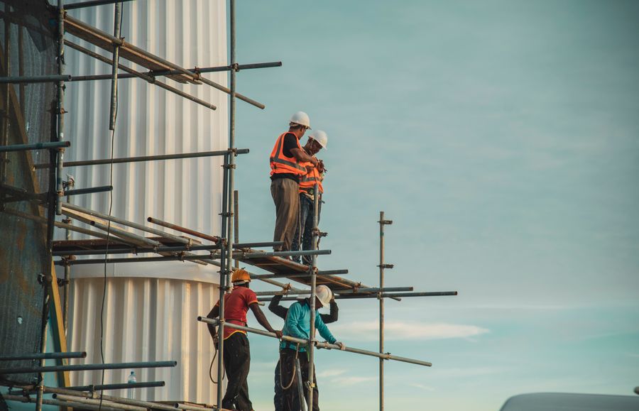Construction workers on a scaffolding structure
