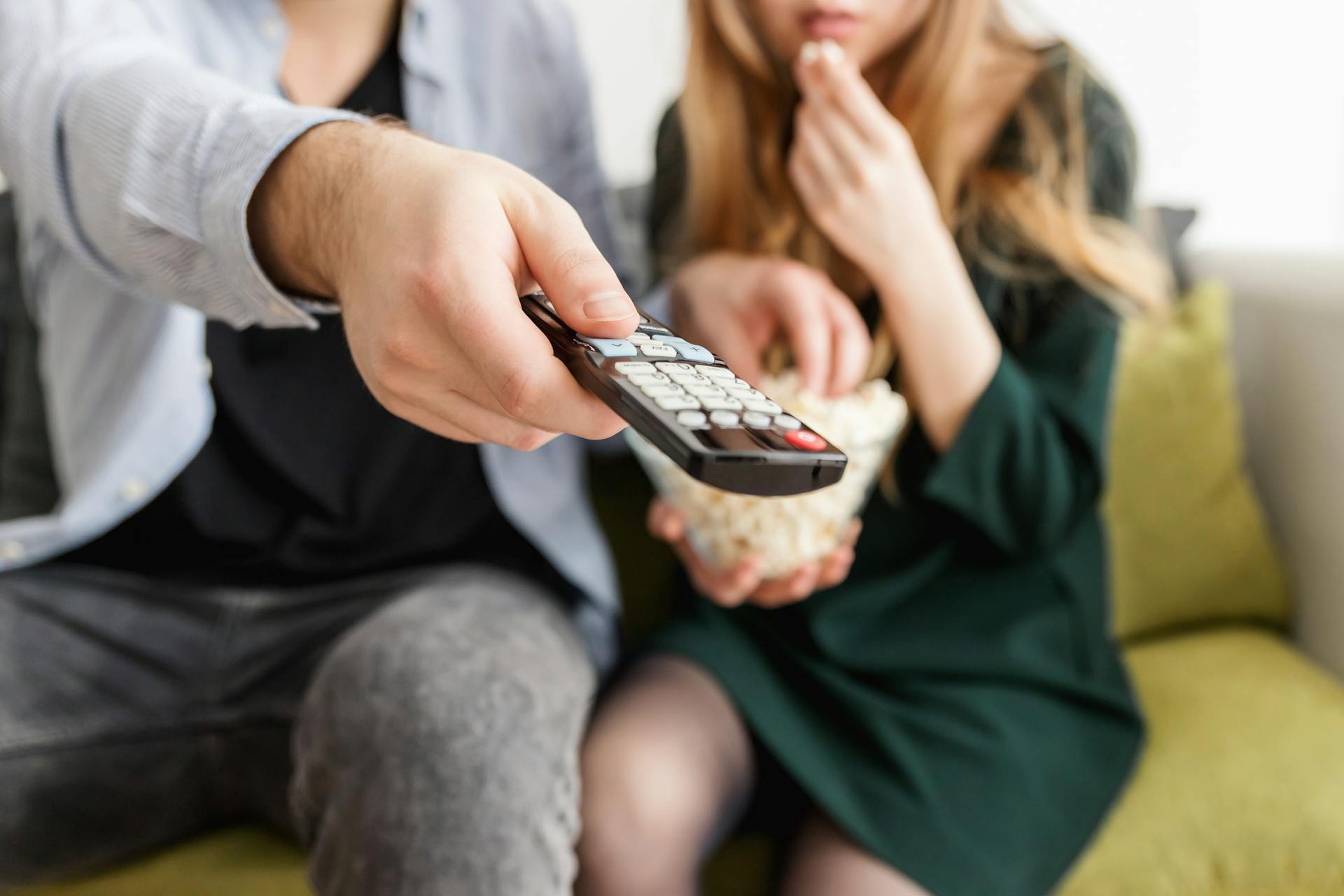 Man Holding Remote Control