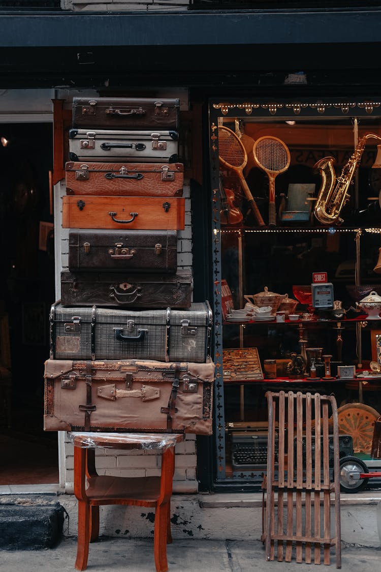 Variety Of Briefcases Stacked Outside An Establishment