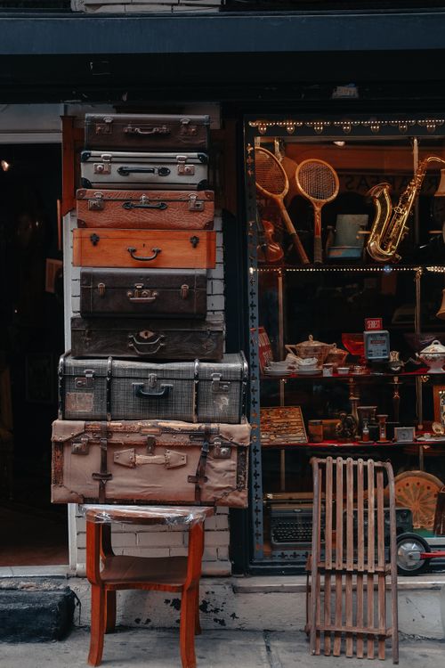 Free Stacked vintage suitcases outside a shop in Istanbul, highlighting retro travel vibes. Stock Photo