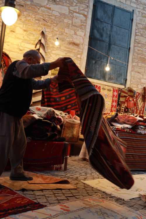 Merchant Selling Rugs · Free Stock Photo