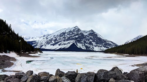 Frozen Lake Near Snow Covered Mountain