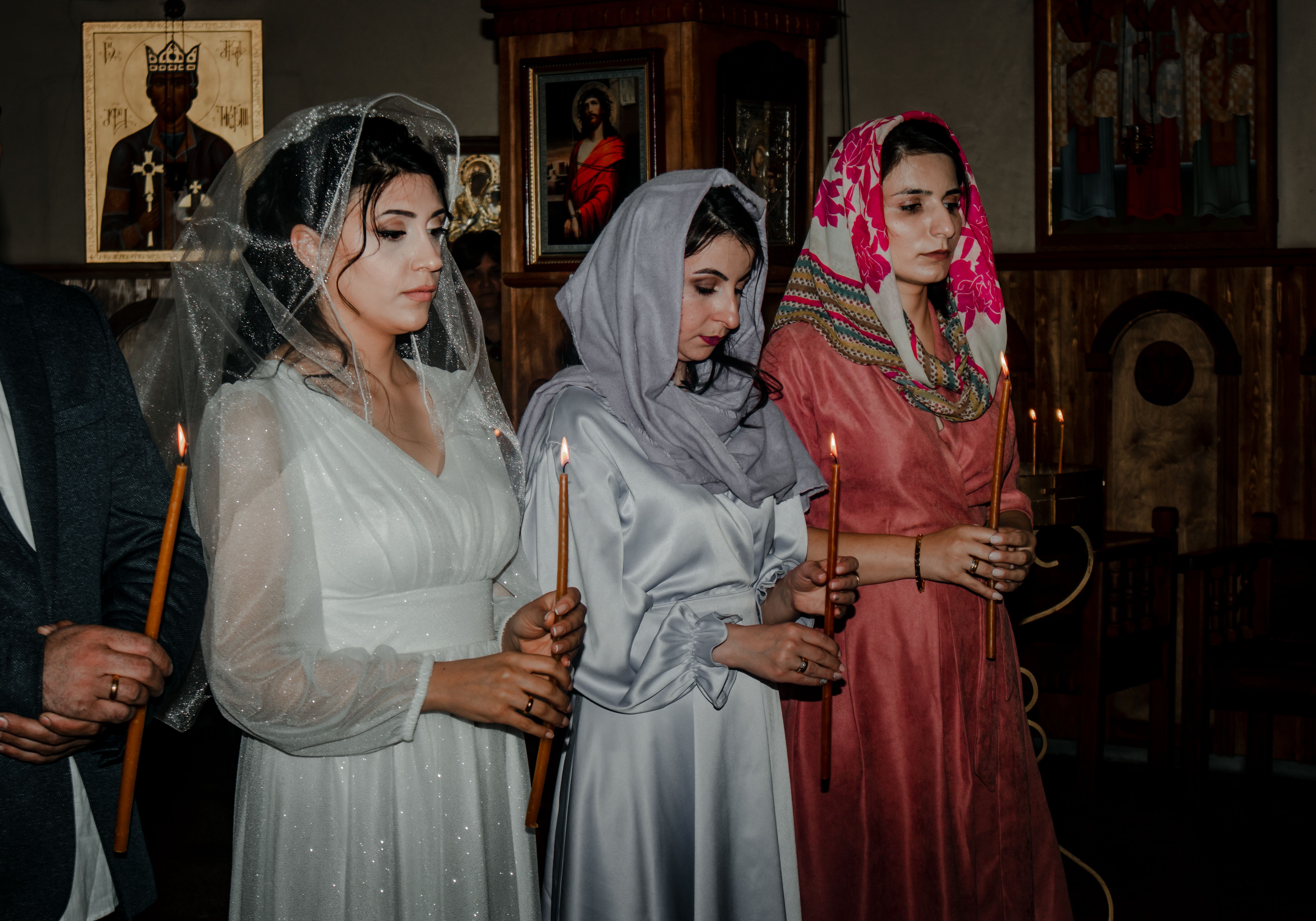 young adults attending modern church service with candles