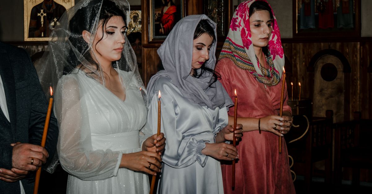 young adults attending modern church service with candles