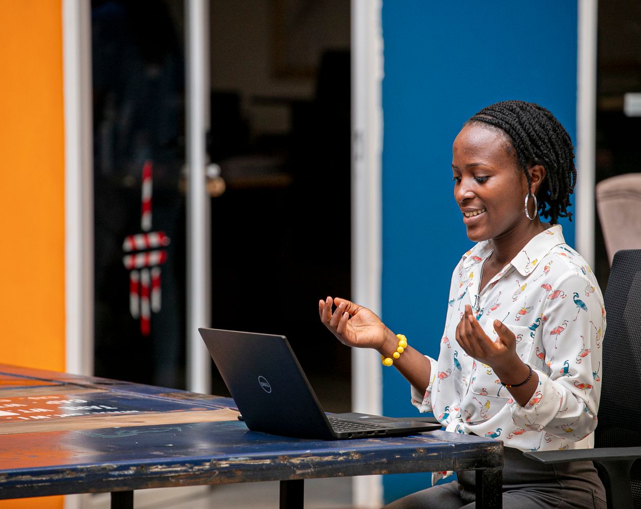 African businesswoman participating in a friendly video call from an office