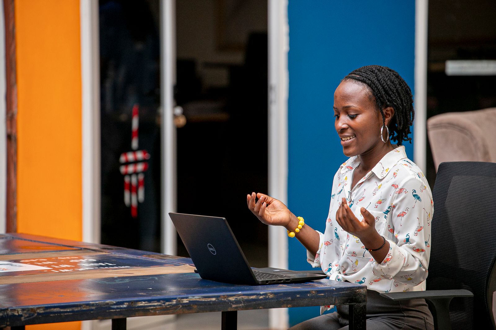African business professional reviewing analytics on a laptop