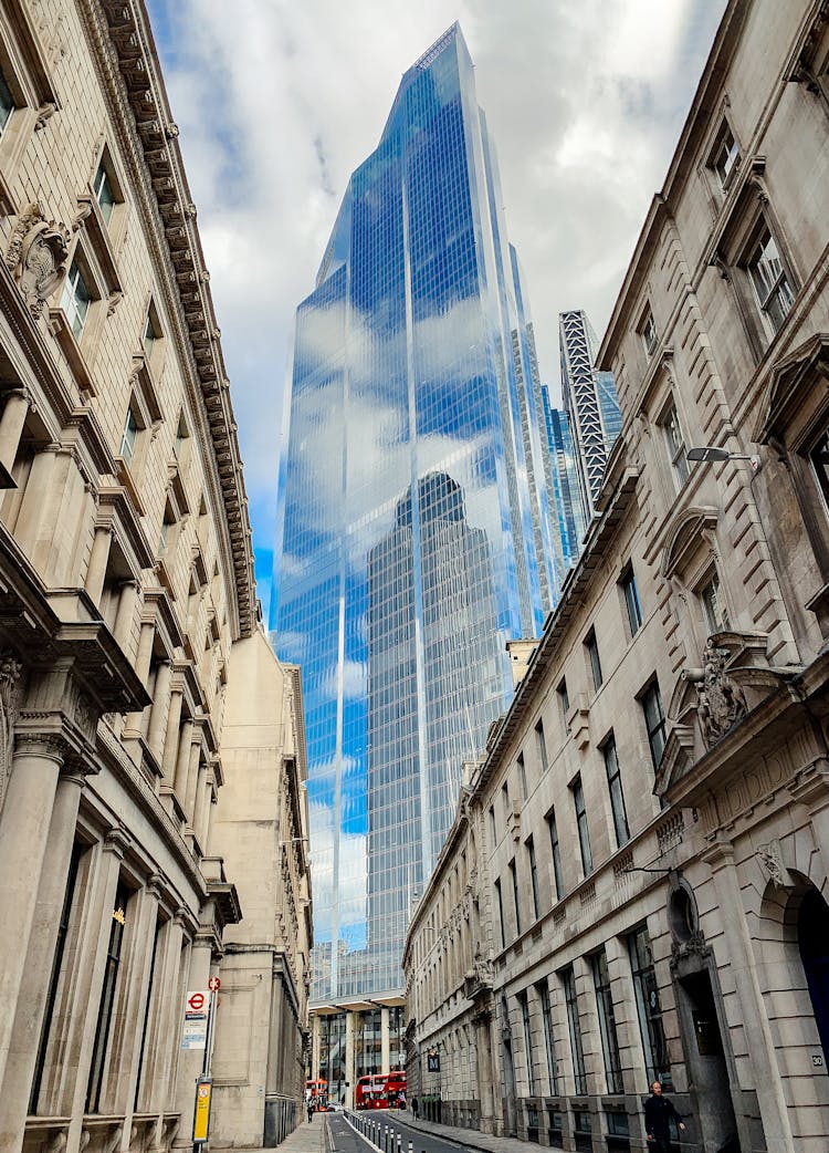 View On Modern Skyscraper From Between Classic 19-th Century Buildings In Central London