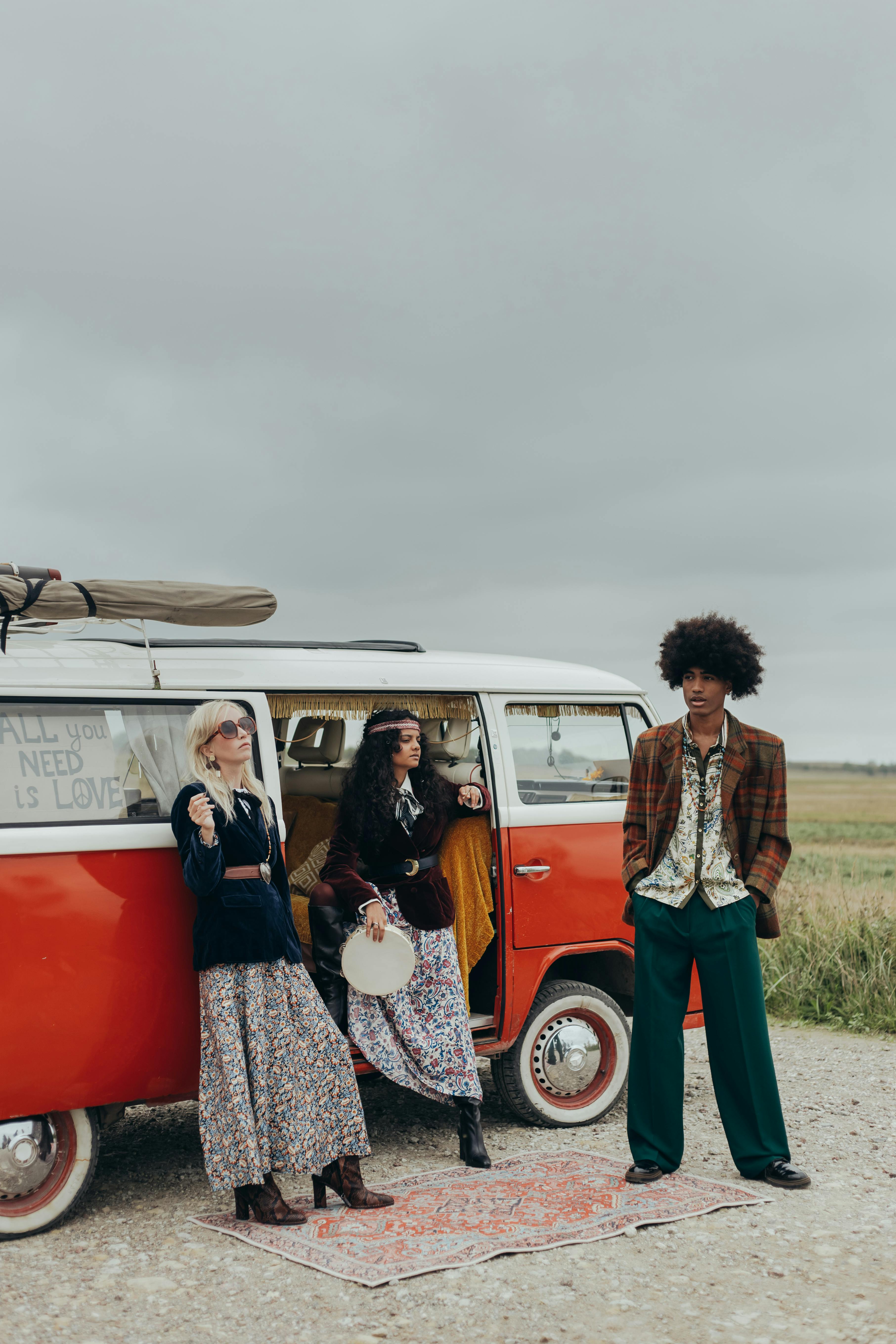 stylish friends standing outside their vehicle