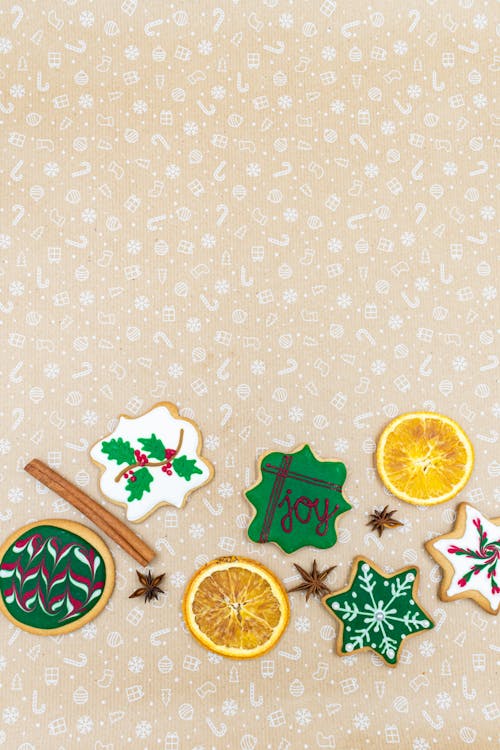 Christmas Cookies and Orange Slices with Cinnamon Stick and Star Anise on Christmas Background