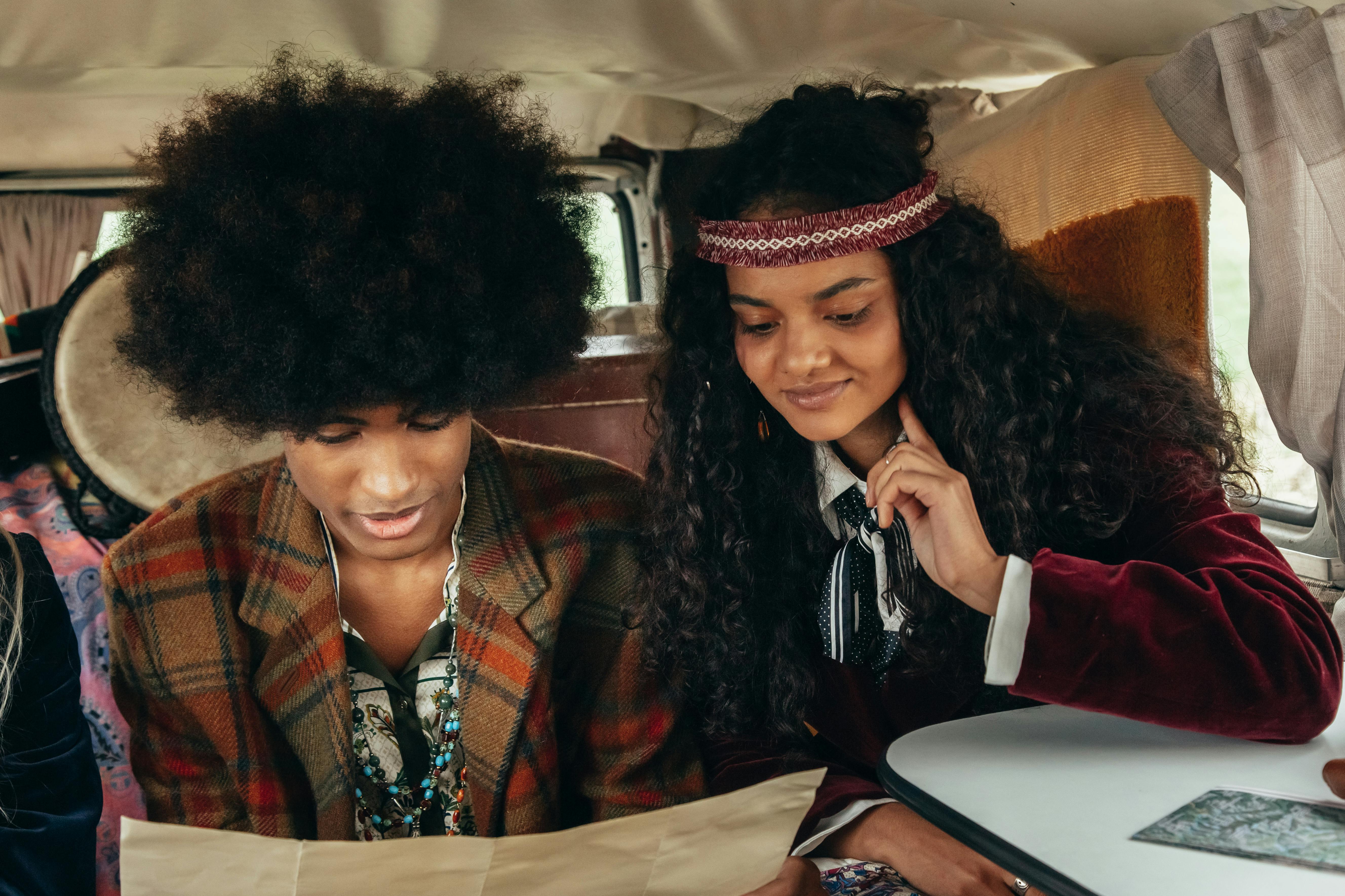 Young couple with retro style enjoying a moment inside a vintage van. Perfect for lifestyle imagery.