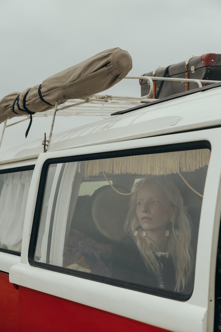 A Woman Inside A White And Red Van