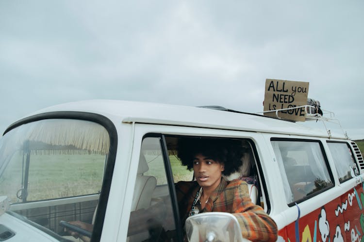 A Man Driving A Camper Van