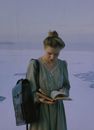 Woman Dressed in Old-Fashioned Outfit in Winter Landscape