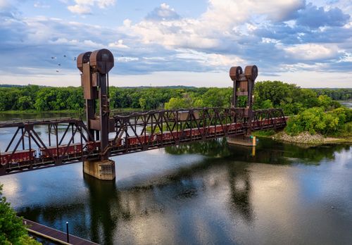Free Aerial view of a steel drawbridge over the St. Croix River in Prescott, Wisconsin during a sunny day. Stock Photo