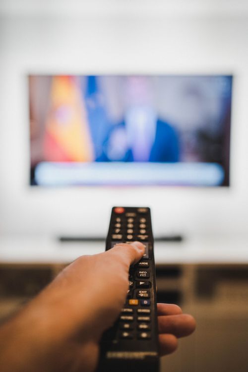 persons holding a red and black remote controllers ·... Person Holding Black Remote Control · Free Stock Photo
