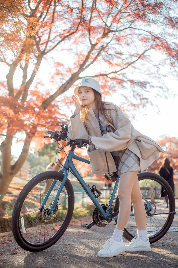 Woman Leaning On A Bicycle