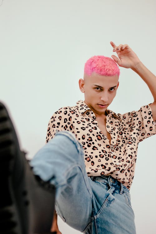 A Man in Leopard Print Shirt and Denim Jeans with Pink Hair