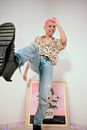 A Low Angle Shot of a Man in Denim Jeans in Kicking Position