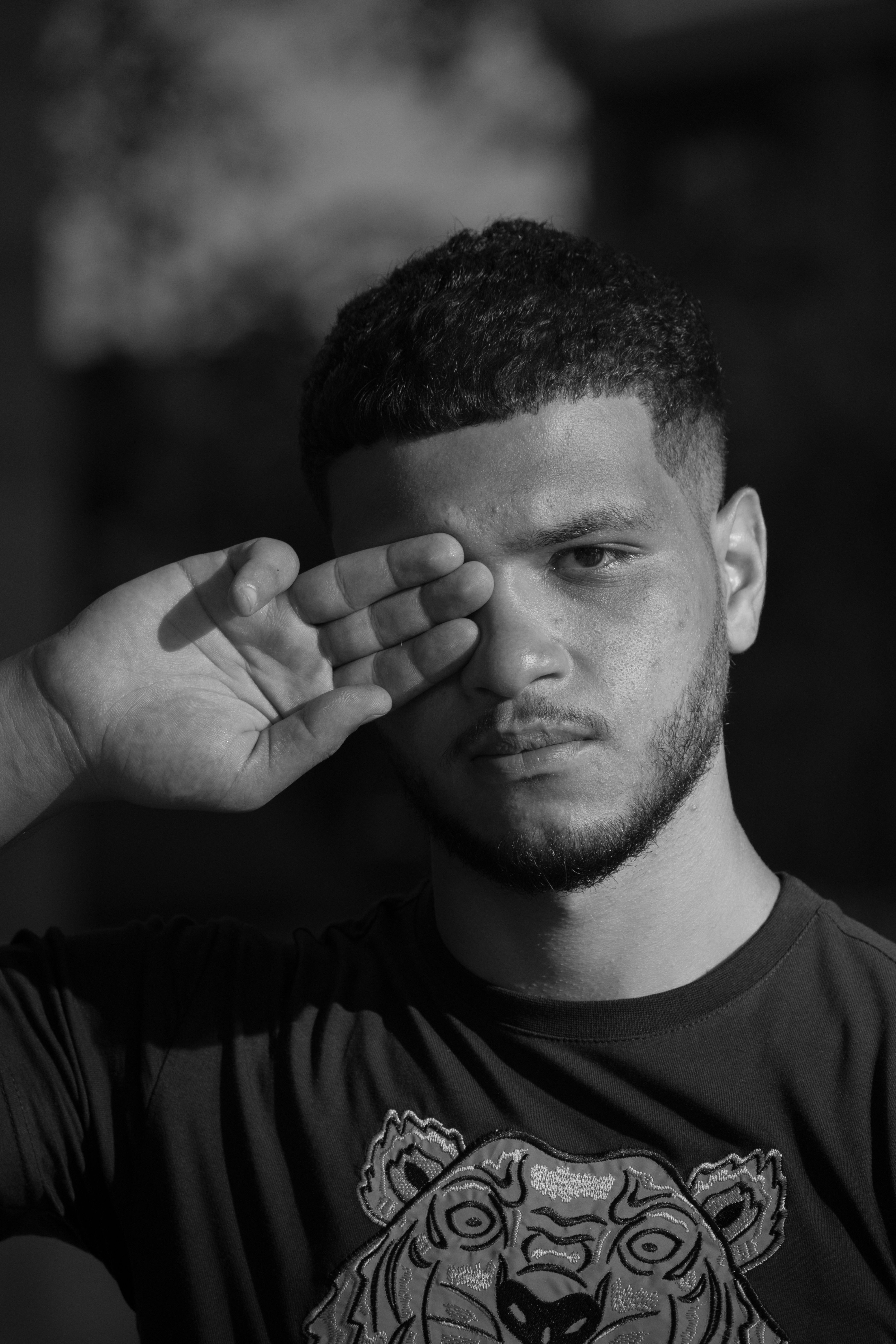 Black and White Photo of Man Covering His Eye · Free Stock Photo
