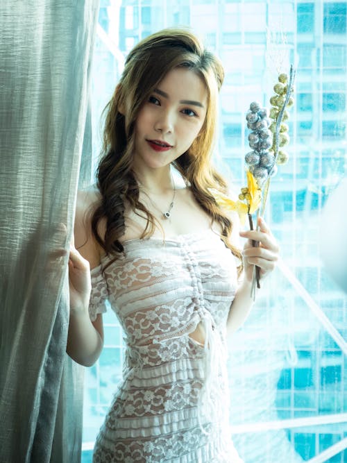 A Beautiful Woman in a White Lace Dress 