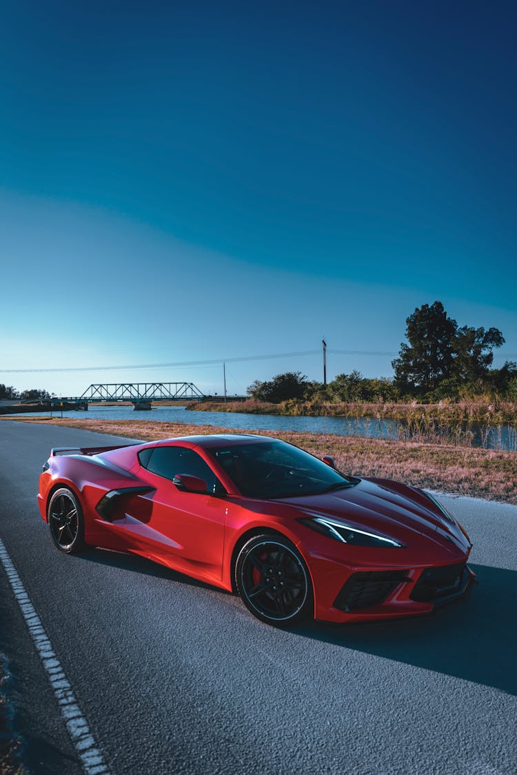 Red Corvette Car On The Road