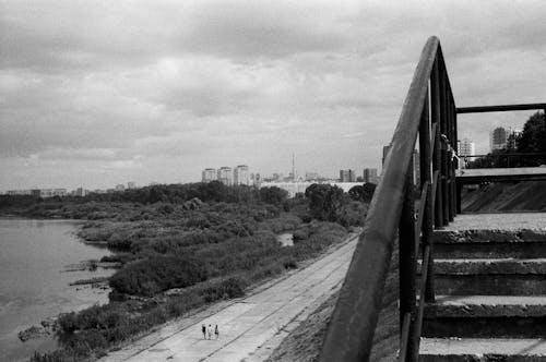 Pavement near River in Black and White