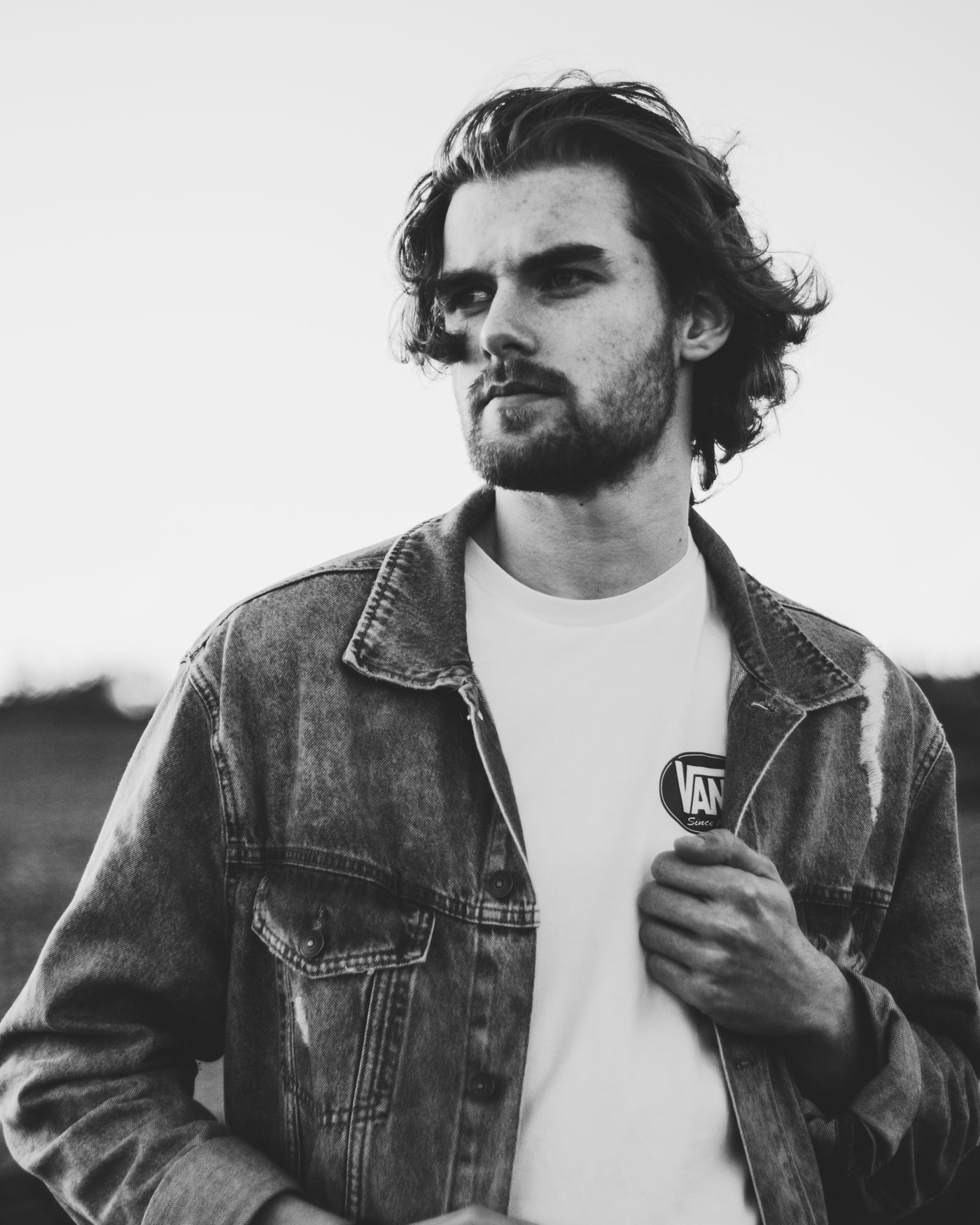 Male model in a refined shirt and jacket with clean menswear styling