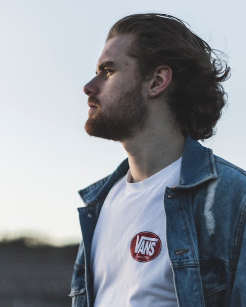 Man Wearing White Crew-neck Vans Top and Blue Denim Button-up Jacket