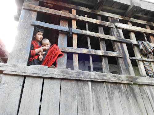 Free stock photo of girl in old house, girl in red cloths, kalash pakistan