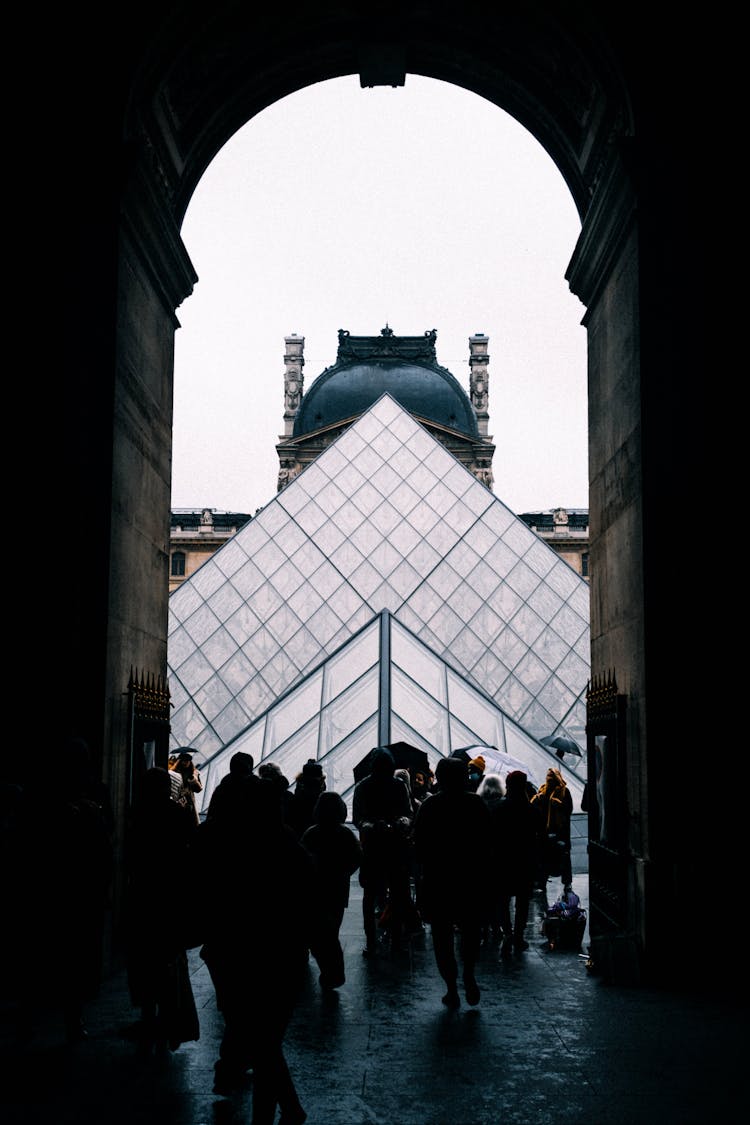 People Walking Into Louvre