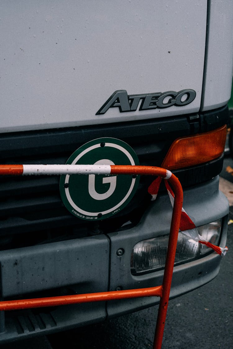 White Truck Parked Close To An Orange Railing