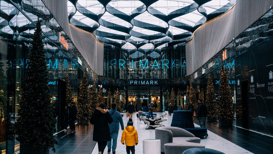 Bright and spacious interior of Skopje City Mall with shoppers