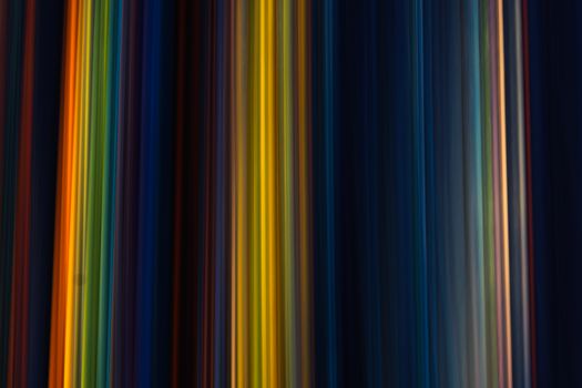 Colorful vertical stripes create a vibrant abstract pattern, ideal for artistic backgrounds or wallpapers.